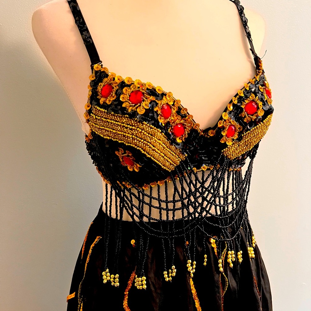 Beaded top and black flowy skirt with sequins.